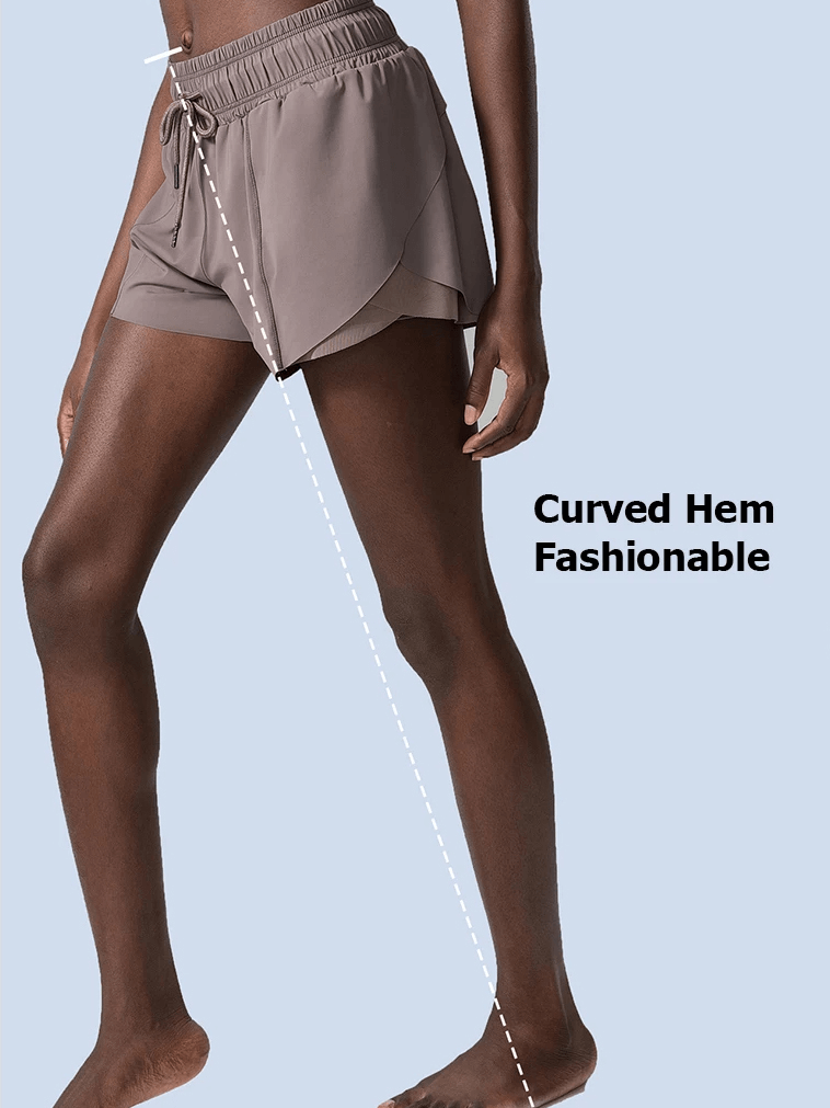 Stylish woman wearing breathable nylon shorts with curved hem for yoga and running.